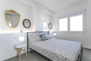 Ένα ή περισσότερα κρεβάτια σε δωμάτιο στο Sunset Holidays