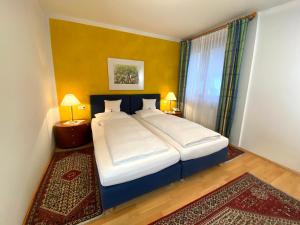 Tempat tidur dalam kamar di Pension Christina