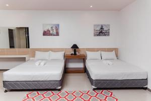 Кровать или кровати в номере Soi Suites