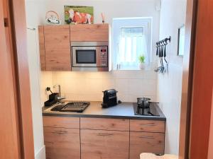 Kuchyň nebo kuchyňský kout v ubytování Appartement BERGTRÄUME