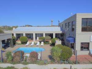 an aerial view of a building with a swimming pool at Seagulls Guest House in Langebaan