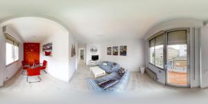 a white living room with a couch and a table at Apartamentos Design Pinemar in Cabañas +16 photos