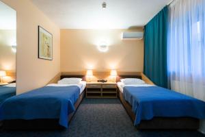 Una cama o camas en una habitación de IBB Hotel