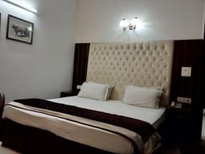 Postel nebo postele na pokoji v ubytování Solo Victoria Hotel