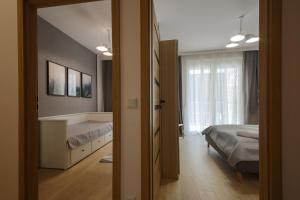 Posteľ alebo postele v izbe v ubytovaní Boogie Apartments