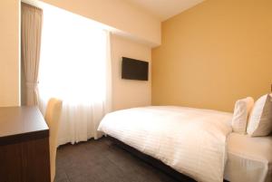 Postel nebo postele na pokoji v ubytování AB Hotel Nara
