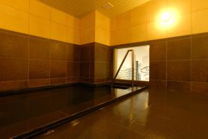 an empty swimming pool with a light on the wall at AB Hotel Nagoya Sakae in Nagoya +18 photos