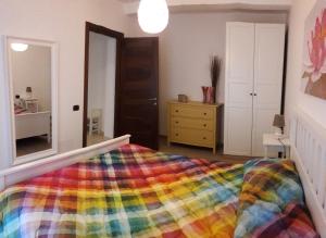 A bed or beds in a room at Alle Porte di Genova