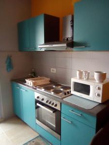 Kuchyň nebo kuchyňský kout v ubytování Apartment Flores centre