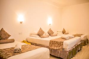 Postel nebo postele na pokoji v ubytování Hotel Sunray