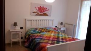 A bed or beds in a room at Alle Porte di Genova