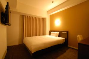 Postel nebo postele na pokoji v ubytování AB Hotel Isesaki