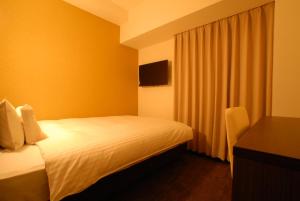 Postel nebo postele na pokoji v ubytování AB Hotel Isesaki