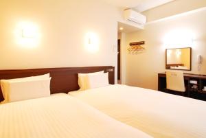 Postel nebo postele na pokoji v ubytování AB Hotel Isesaki + 24 fotografií
