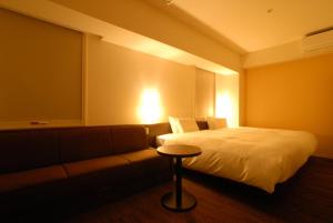 Postel nebo postele na pokoji v ubytování AB Hotel Isesaki
