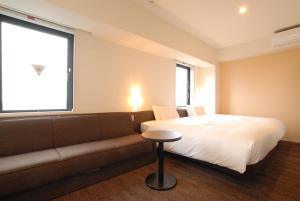 Postel nebo postele na pokoji v ubytování AB Hotel Isesaki