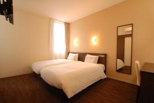 Postel nebo postele na pokoji v ubytování AB Hotel Isesaki