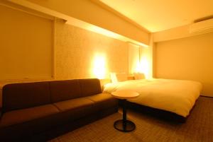 Postel nebo postele na pokoji v ubytování AB Hotel Fuji
