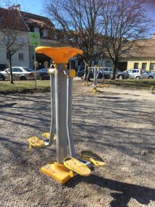 a group of playground equipment in a park at Natalex Apartments in Vilnius