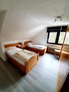 Ein Bett oder Betten in einem Zimmer der Unterkunft Landhaus Dahlem