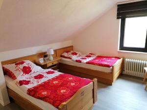 Ein Bett oder Betten in einem Zimmer der Unterkunft Landhaus Dahlem