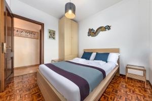 a bedroom with a large bed in a room at Villa Regina Bella by Casa da Suite in Nebbiuno +23 photos