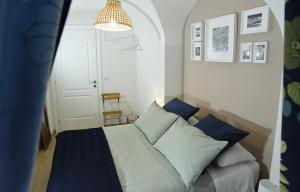 Ліжко або ліжка в номері A Casa di Costanza