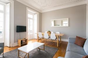 a living room with a couch and a table at Principe by Central Hill Apartments in Lisbon