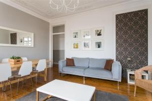 a living room with a couch and a table at Principe by Central Hill Apartments in Lisbon