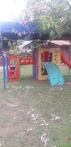 a group of childrens play equipment in a park at CHALES AABB SALVADOR(BA) in Salvador