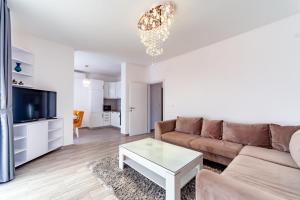 Televiisor ja/või meelelahutuskeskus majutusasutuses Apartments Monte Re