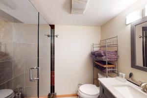 a bathroom with a shower and a toilet and a sink at Jarvis #202 in Durango +31 photos