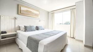 Un ou plusieurs lits dans un hébergement de l'établissement Danieri Asunción Hotel