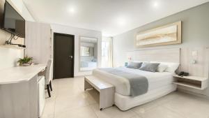 Un ou plusieurs lits dans un hébergement de l'établissement Danieri Asunción Hotel
