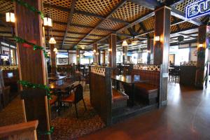 a dining room with tables and chairs in a restaurant at Canad Inns Destination Center Grand Forks in Grand Forks