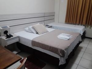 Postel nebo postele na pokoji v ubytování Esplendor Palace Hotel