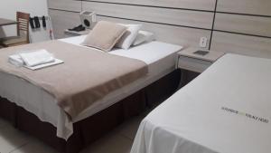 Postel nebo postele na pokoji v ubytování Esplendor Palace Hotel