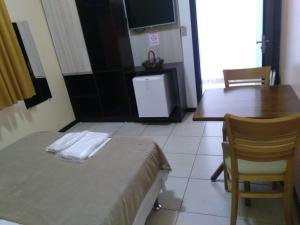 Postel nebo postele na pokoji v ubytování Esplendor Palace Hotel