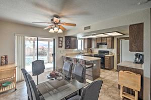 a kitchen and dining room with a ceiling fan at Single-Story Home with Yard, 1 Mi to Windsor Launch! in Lake Havasu City