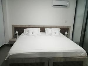 Postel nebo postele na pokoji v ubytování Berilo Deluxe Apartahotel