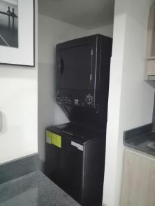 Kuchyň nebo kuchyňský kout v ubytování Berilo Deluxe Apartahotel