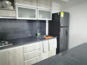 Kuchyň nebo kuchyňský kout v ubytování Berilo Deluxe Apartahotel