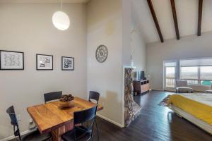 a bedroom with a dining room table and a bed at Aspenwood 4220 in Pagosa Springs