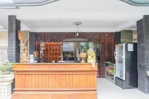 a store front with a counter and a refrigerator at Mahendra Beach Inn in Kuta