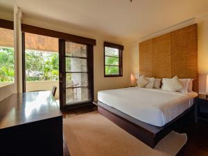 Ένα ή περισσότερα κρεβάτια σε δωμάτιο στο Ruby Nusa Dua Bali