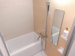 Koupelna v ubytování ゲストハウス高円寺純情ホテル -Guest House Koenji Junjo Hotel-
