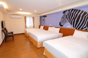 Postel nebo postele na pokoji v ubytování Chinshang Pastoral Farm Resort