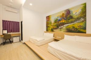 Cama o camas de una habitación en Xiaoliuqiu 88 Homestay