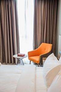 Postel nebo postele na pokoji v ubytování GRAND FLORA HOTEL
