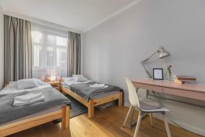Posteľ alebo postele v izbe v ubytovaní oompH Wroclaw Old Town Apartment + 36 fotografií